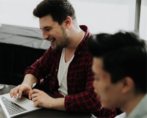 Image of happy employee on a computer